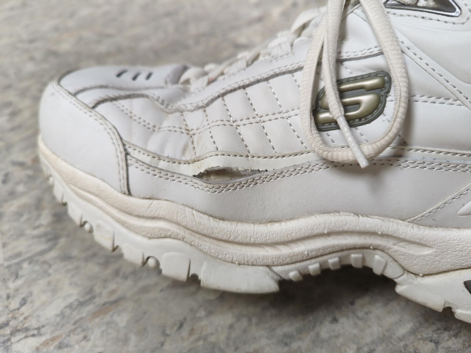 Skechers Energy Afterburn showing typical wear patterns and seam separation after extended use