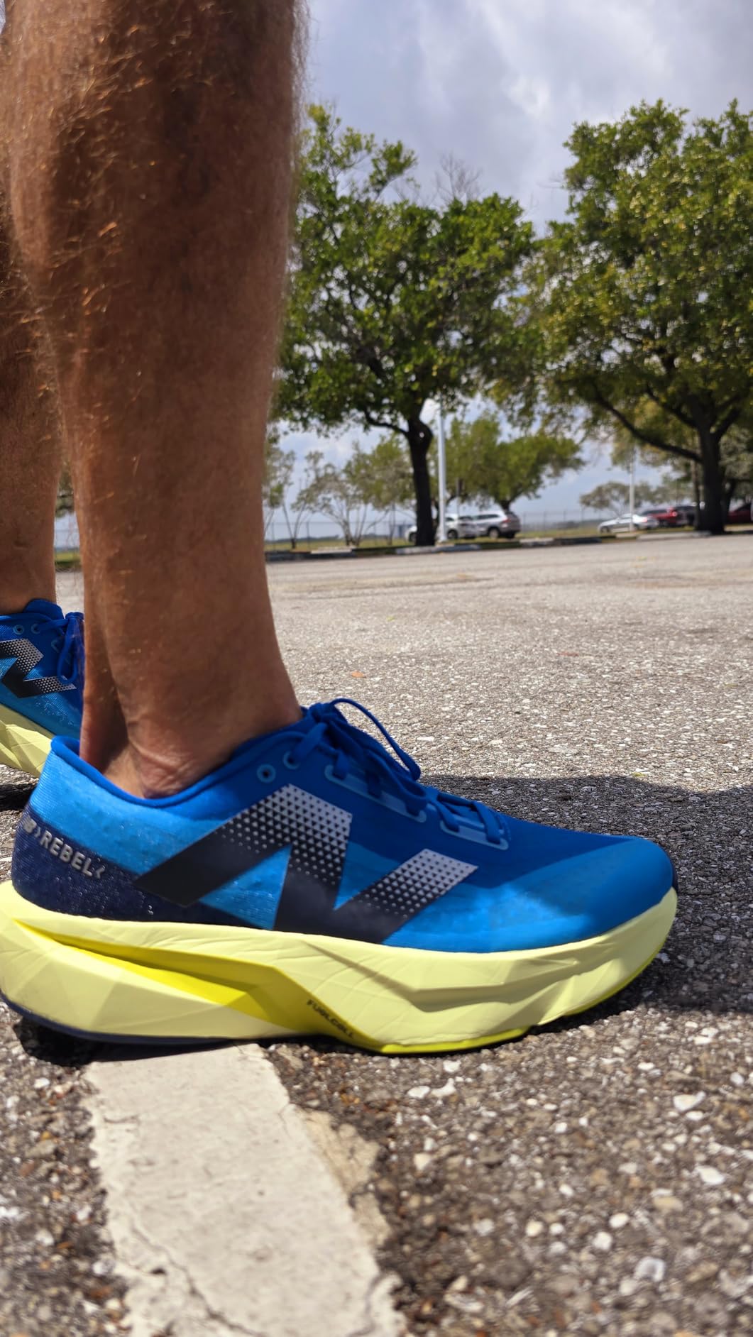 Close-up detail of New Balance Rebel V4 showing geometric FuelCell midsole and semi-gusseted tongue construction