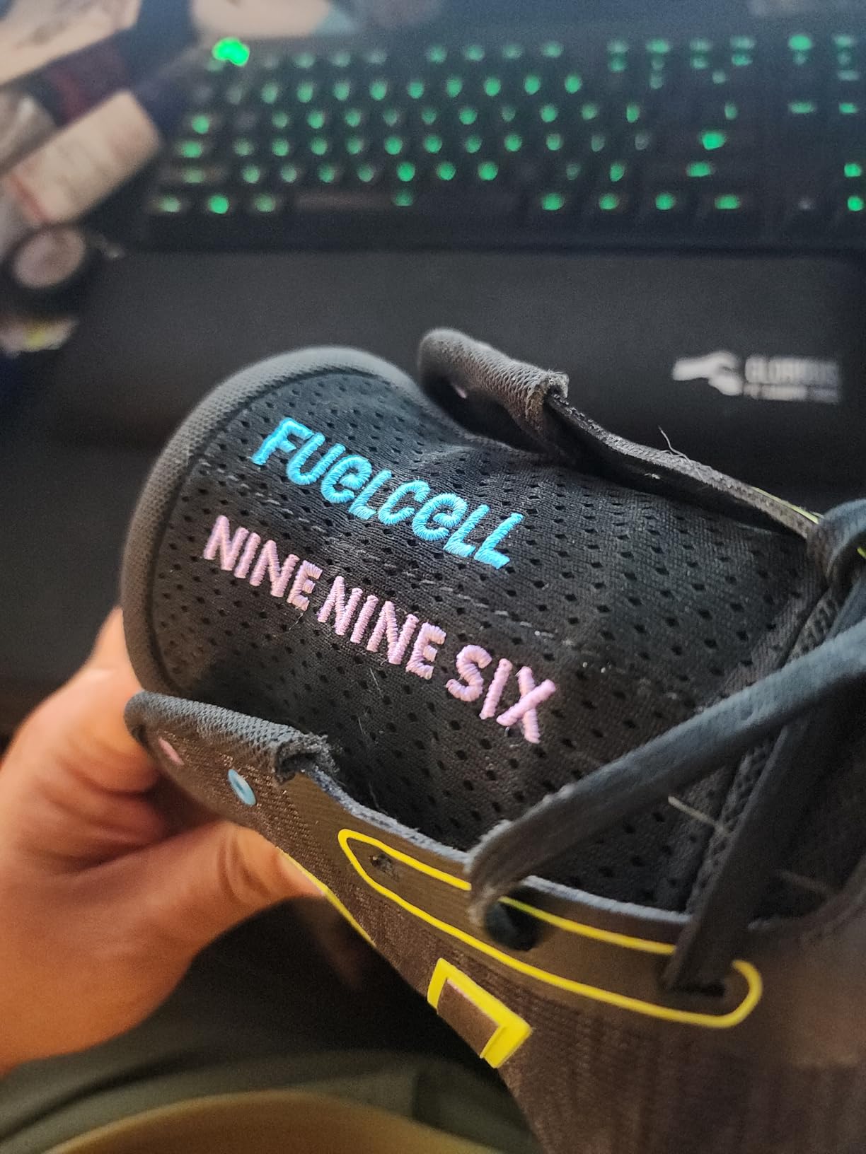 New Balance 996 V5 white and blue colorway on court surface