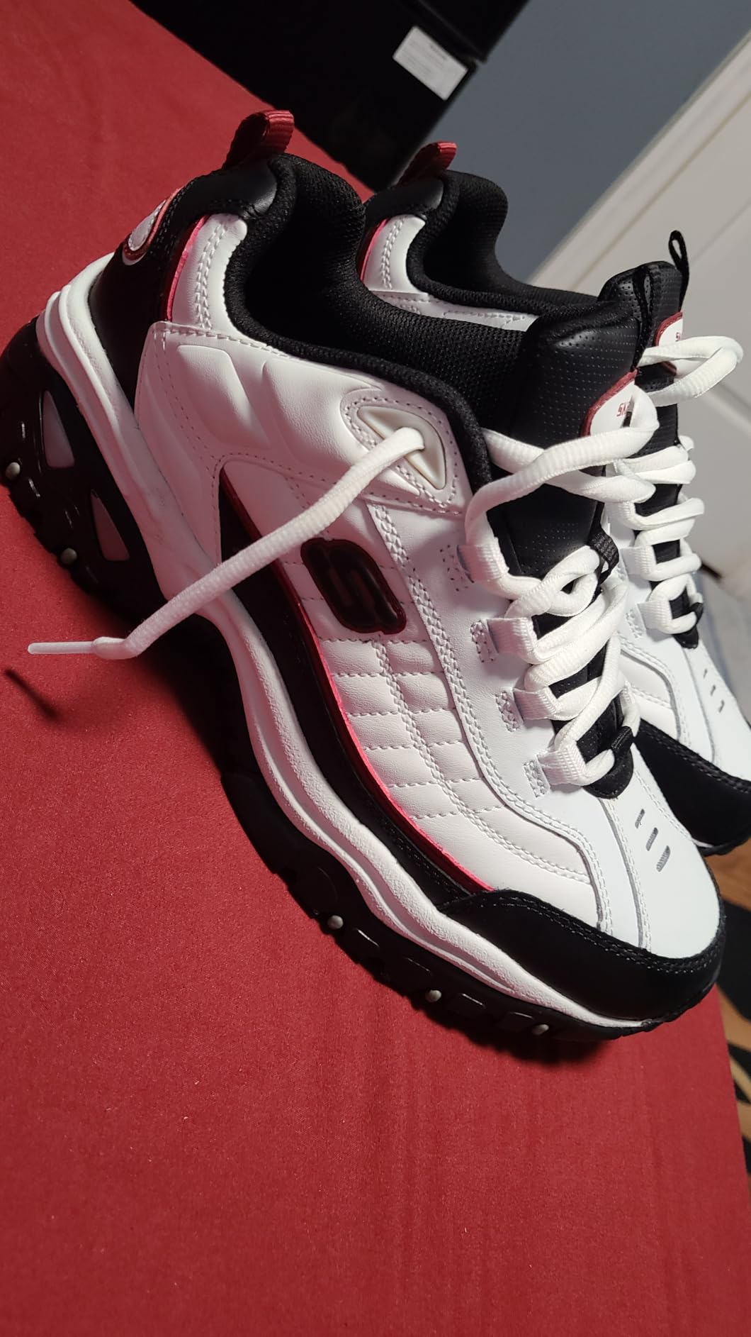 Skechers Energy Afterburn in professional office setting showing versatile workplace use