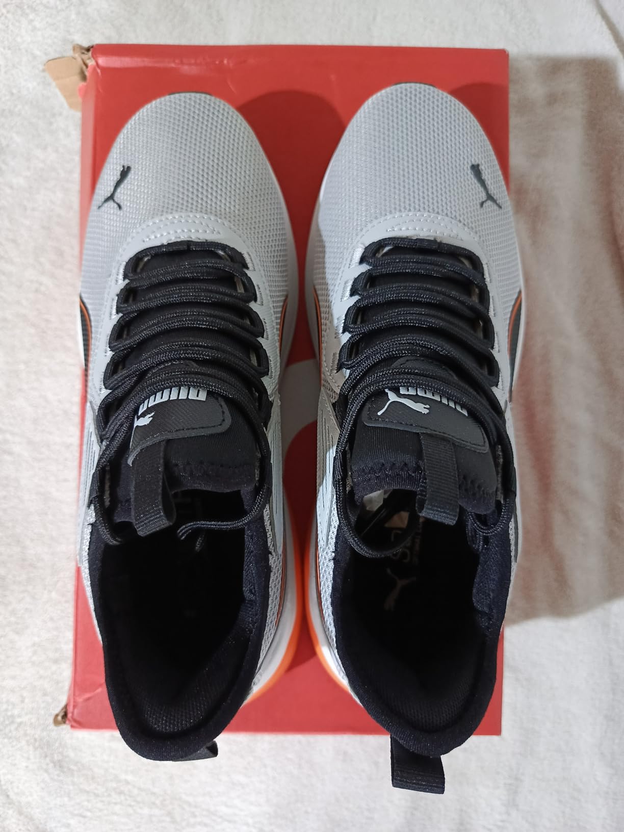 PUMA Men's Amplifier Sneaker shown in casual lifestyle wear context