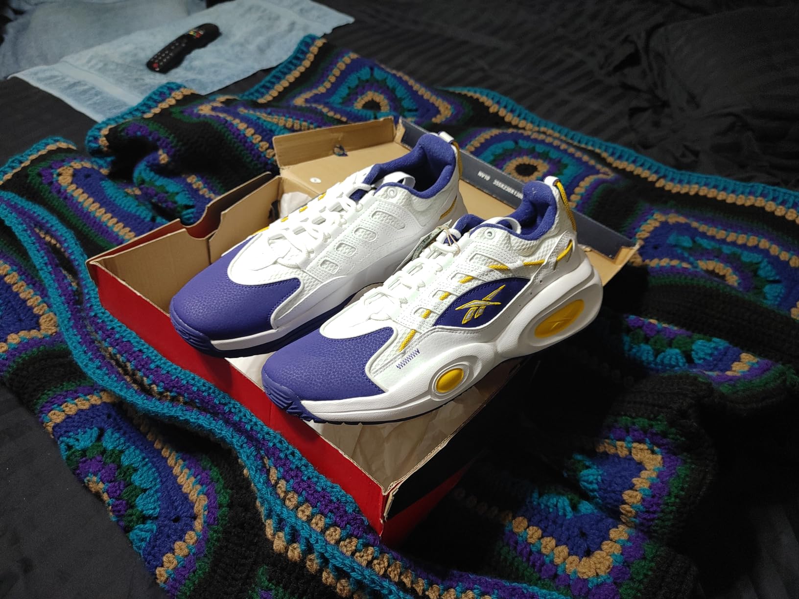 Reebok Solution Mid basketball shoe showing detailed upper construction and Iverson branding