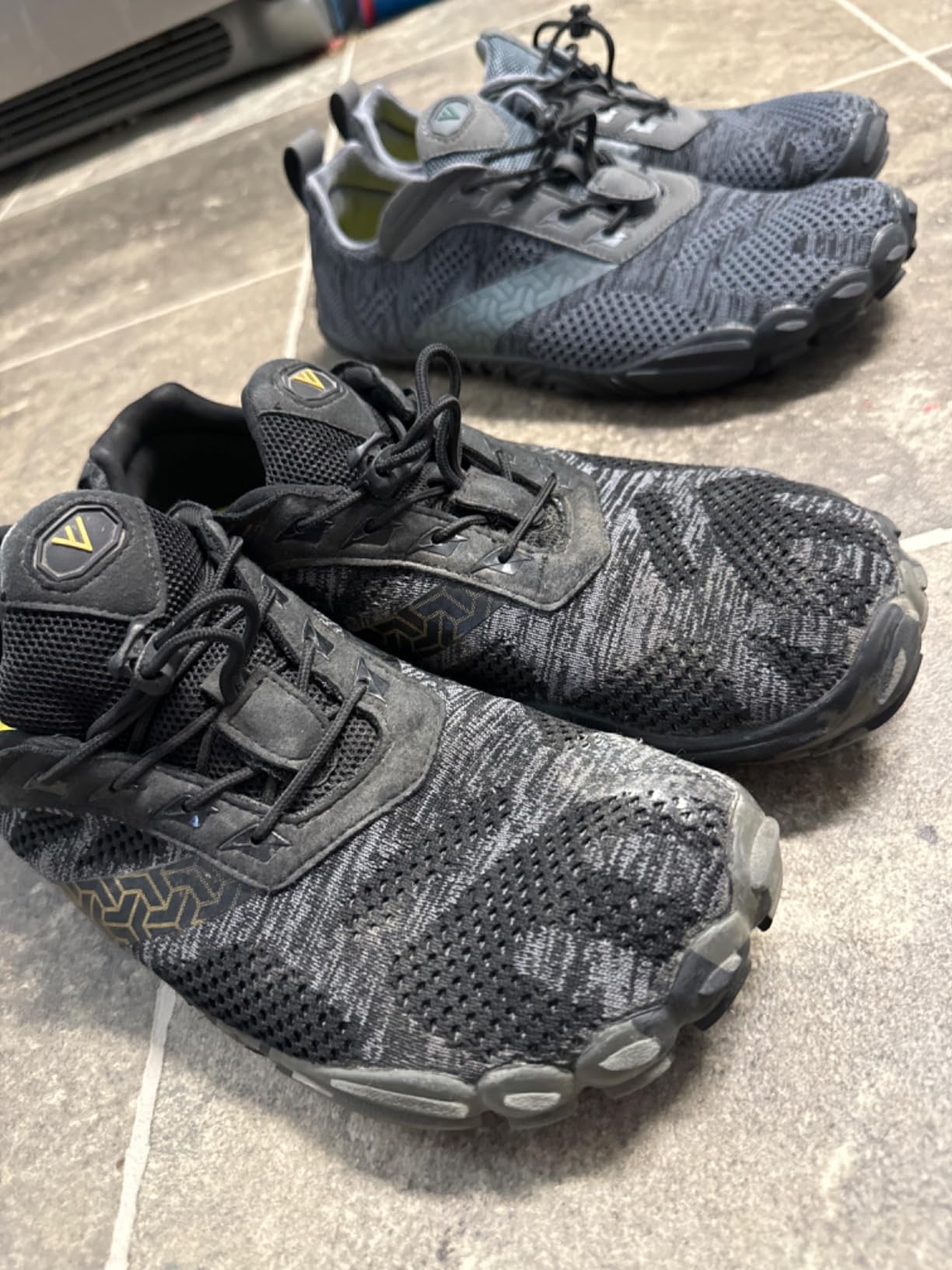 Close-up of WHITIN mesh upper and flexible rubber sole showing construction details