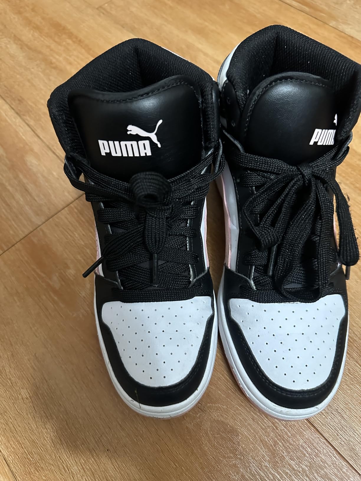 PUMA Rebound Layup Mid kids shoes in action during basketball play showing performance and traction