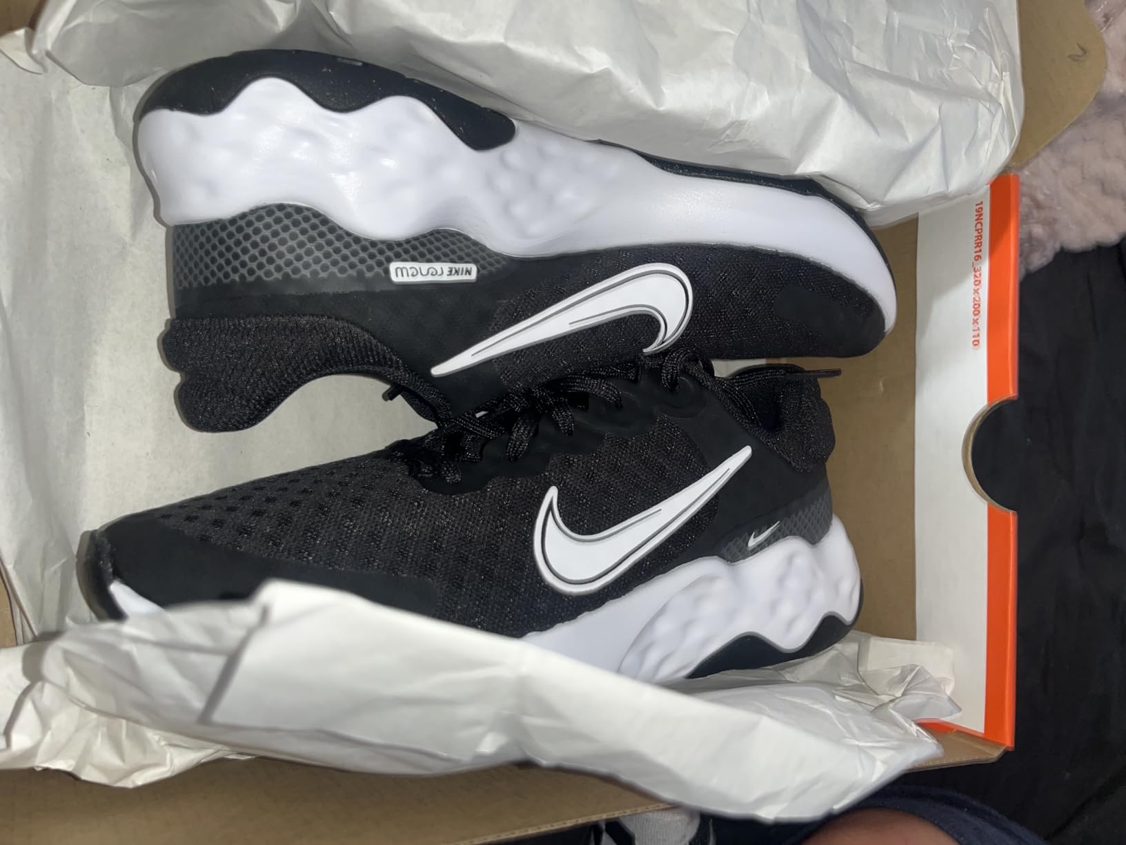 Nike Women's Renew Ride 3 detail showing lightweight mesh upper construction and reinforced toe overlay