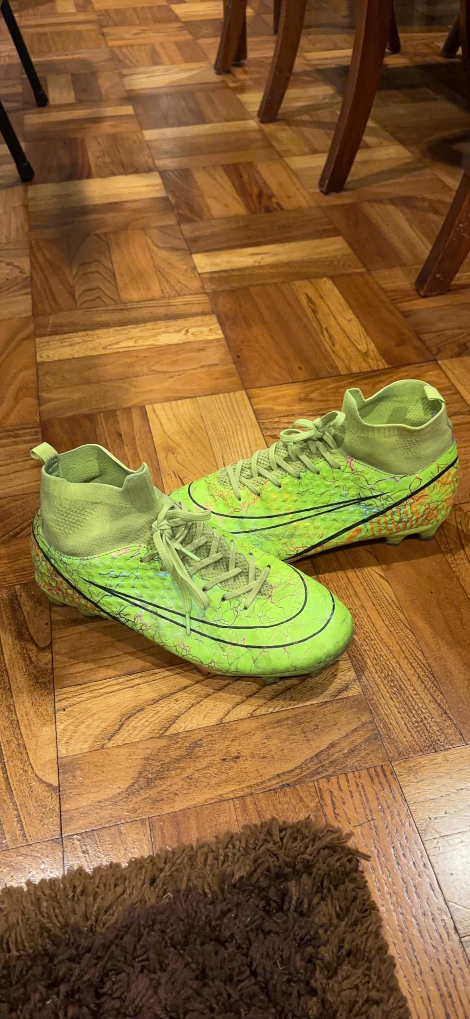 Soccer cleats after several months of use showing wear patterns and durability