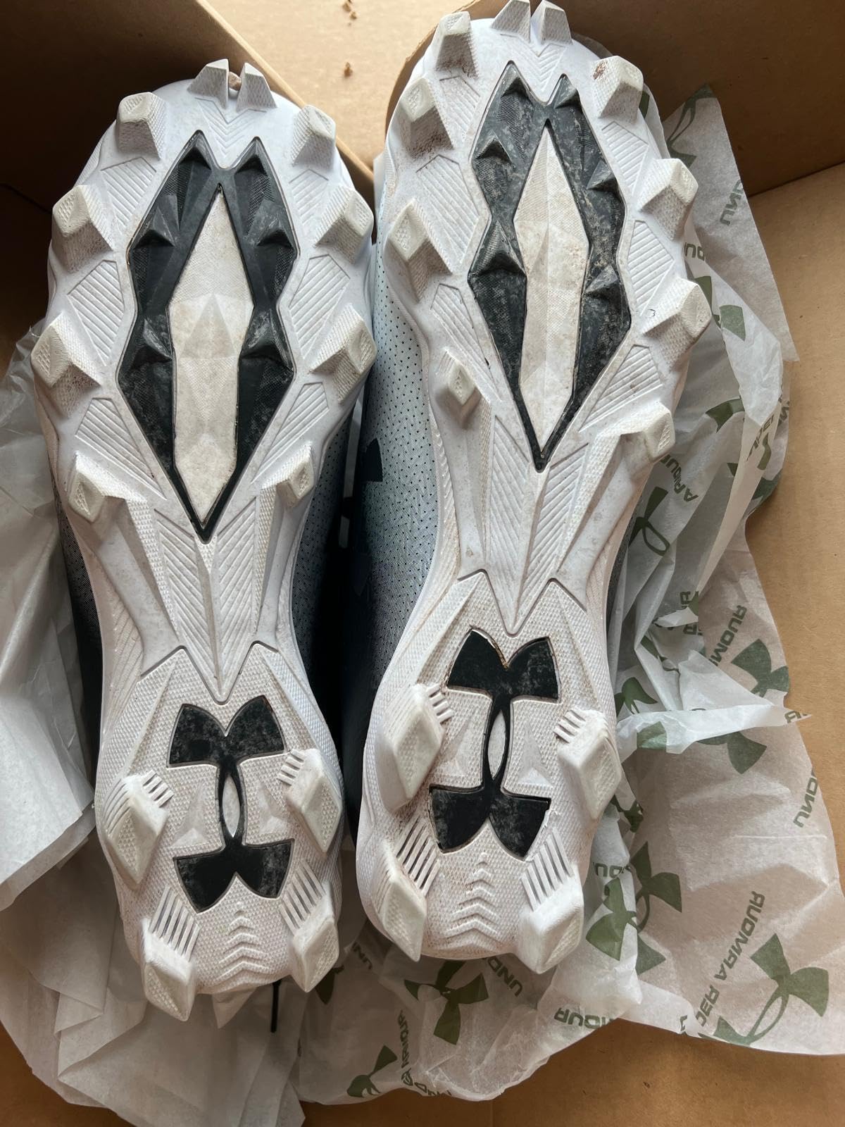 Under Armour Spotlight Franchise Rm 4.0 football cleats during field performance testing on grass