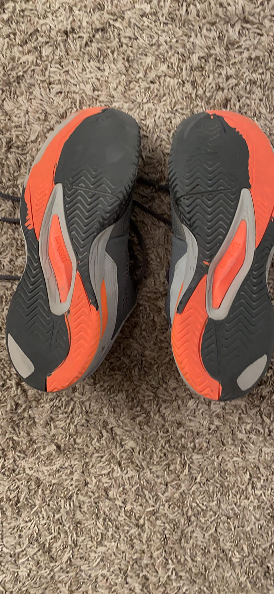 Wilson Rush Pro Ace tennis shoes during actual court testing showing performance on hard court surface with player in action