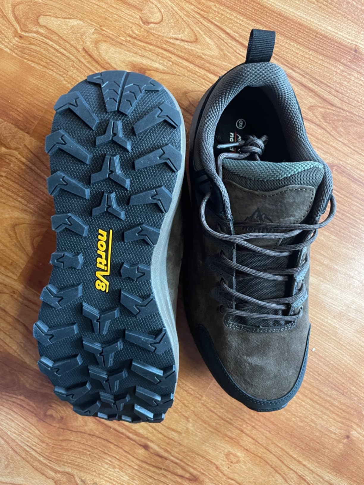 NORTIV 8 shoes on rocky trail terrain showing aggressive rubber outsole tread pattern