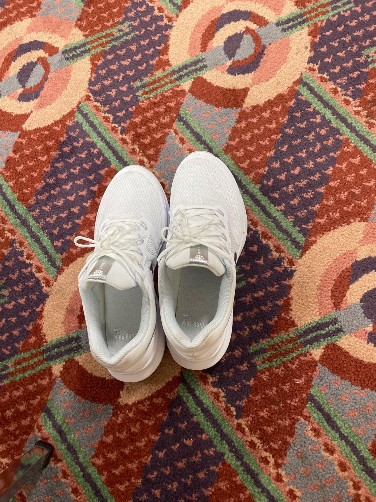 Nike Air Winflo 9 Women's Sneaker White Metallic Silver colorway showing lightweight mesh upper design