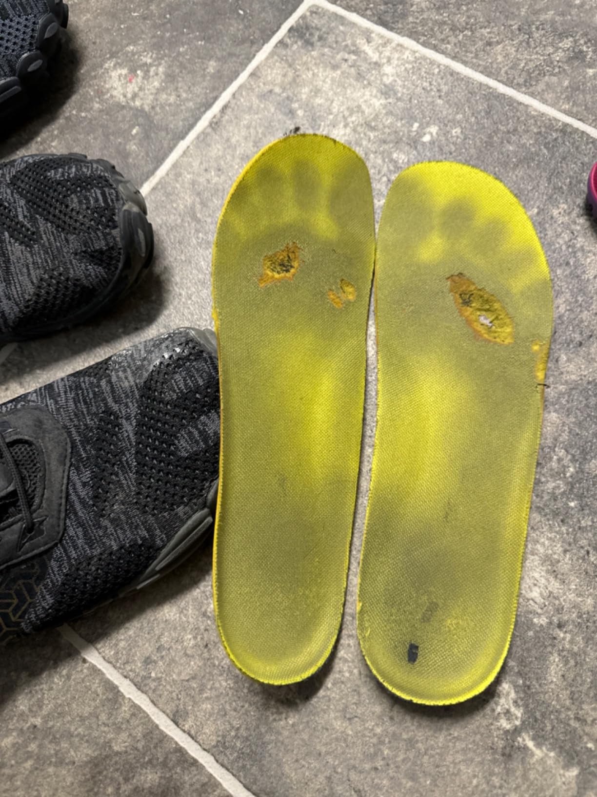 WHITIN shoes on trail showing rubber tread engaging with dirt terrain during actual use