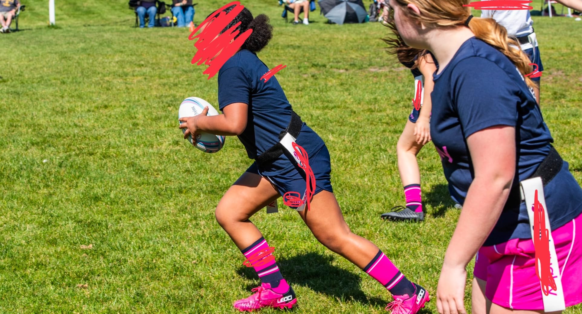 Pink LEOCI cleats on field showing traction pattern and field performance testing