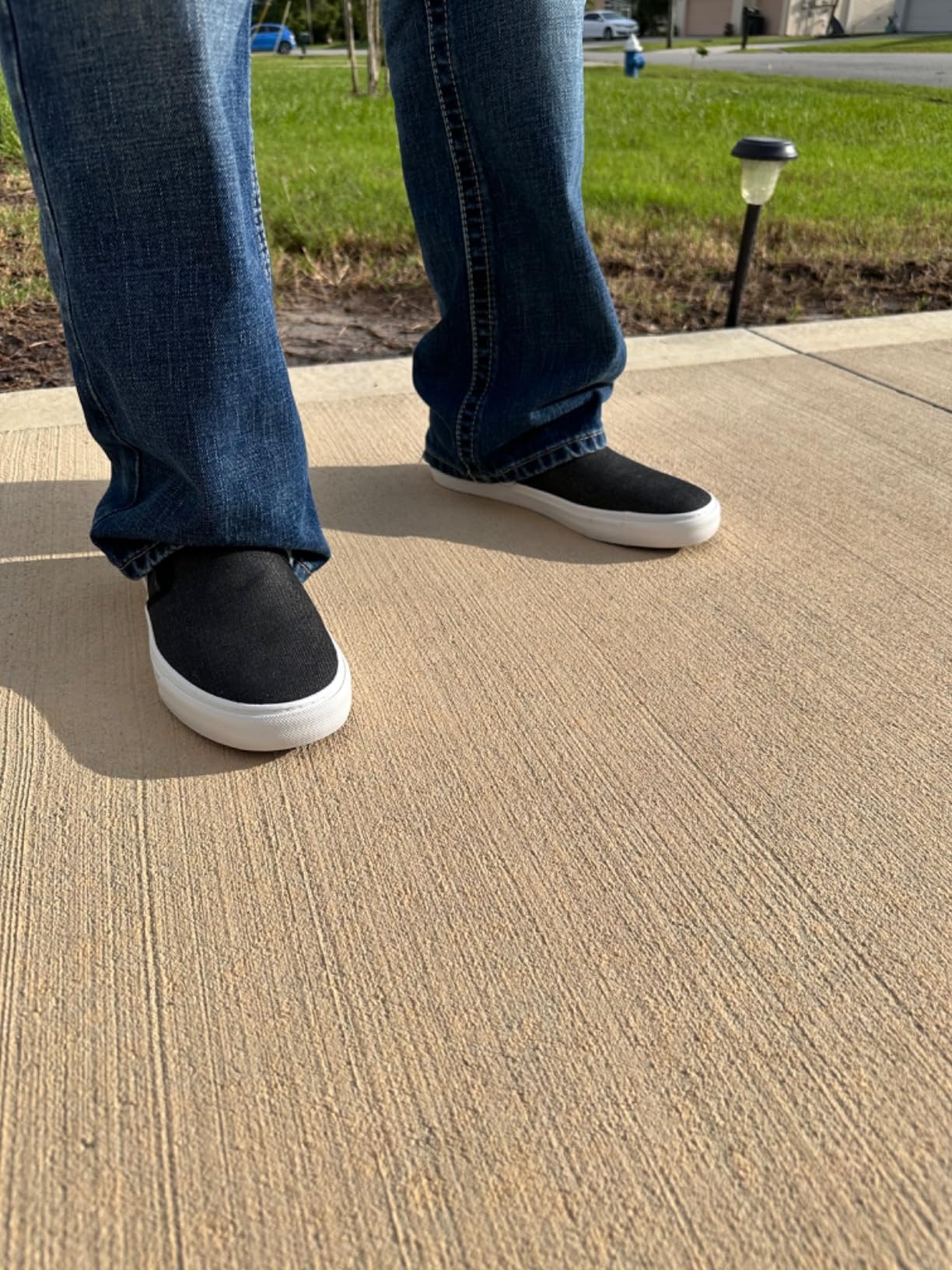 Final product shot of Men's Classic Low Top Slip-On Canvas Sneakers emphasizing olive colorway and low-profile design