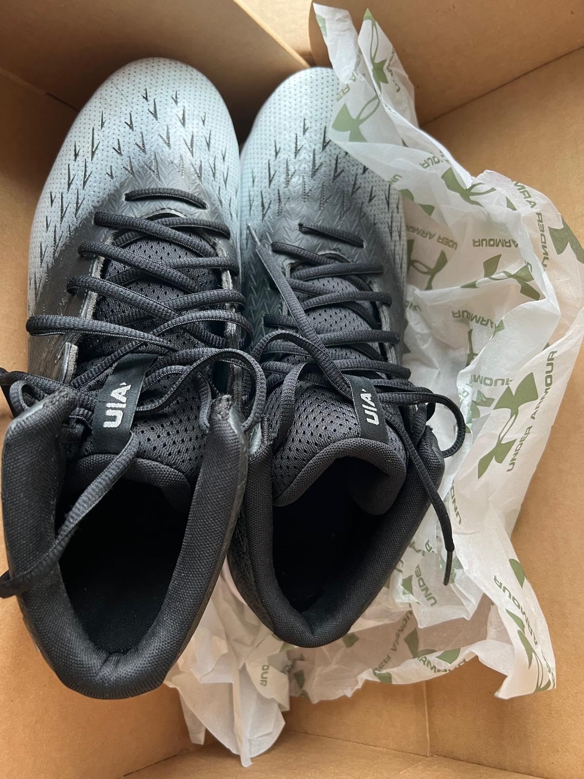 Under Armour Spotlight Franchise Rm 4.0 football cleats showing wear patterns after extended season use