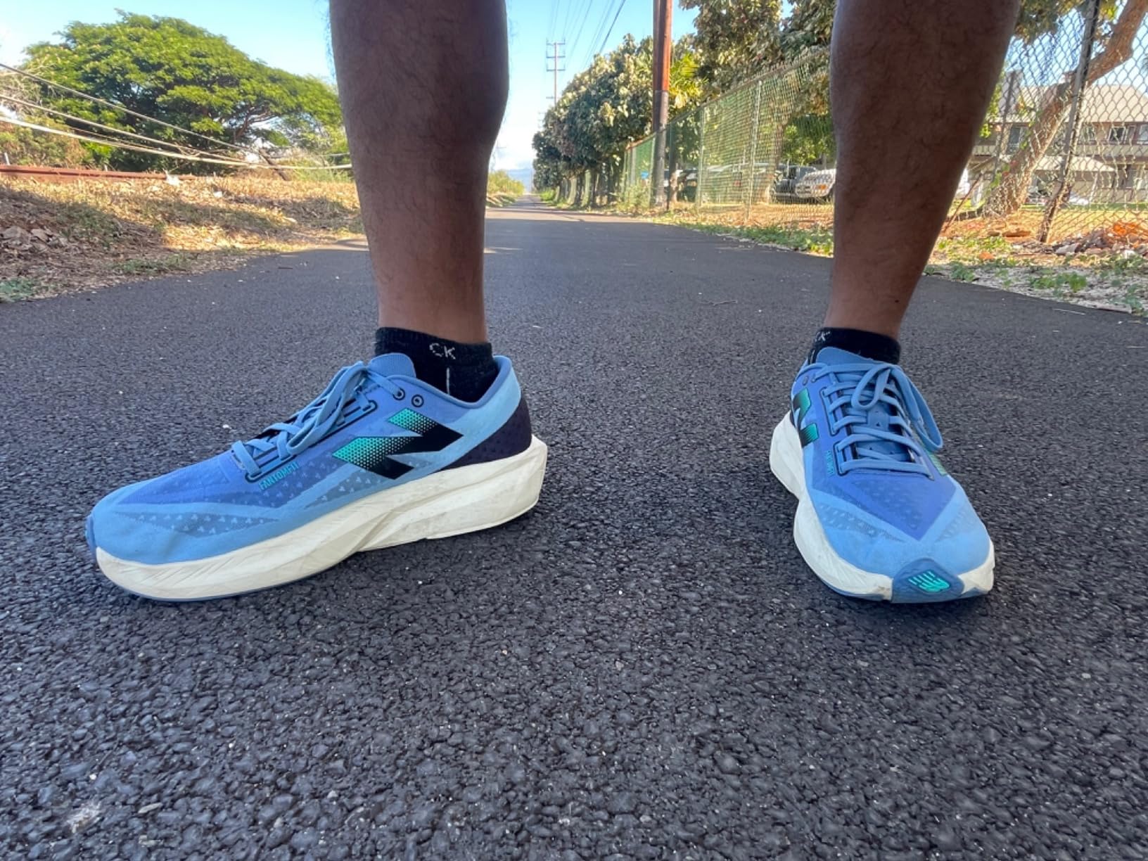 New Balance FuelCell Rebel V4 in blue colorway showing lightweight mesh upper and FuelCell midsole geometry