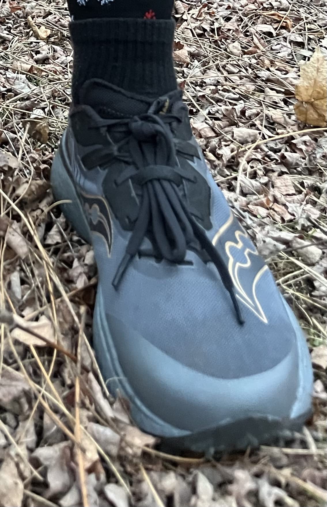 Saucony Endorphin Edge lateral profile showing carbon-plated midsole and lightweight mesh upper