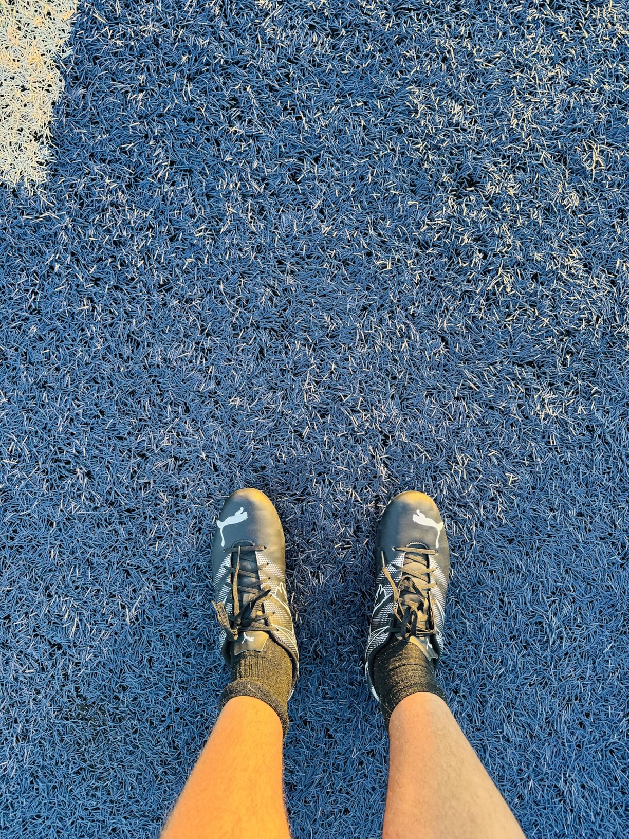 PUMA Attacanto detail showing synthetic upper construction and textured contact zones for ball control