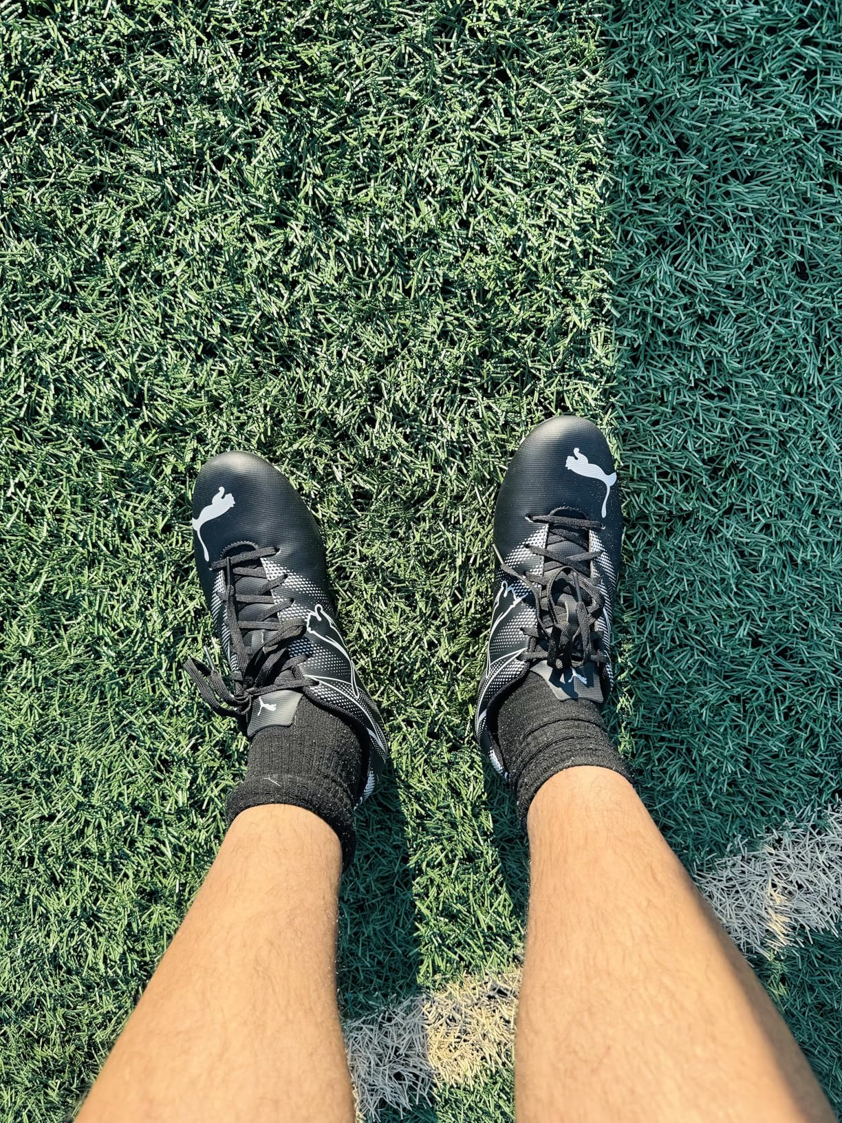 PUMA Attacanto in action showing stud pattern and field performance during gameplay