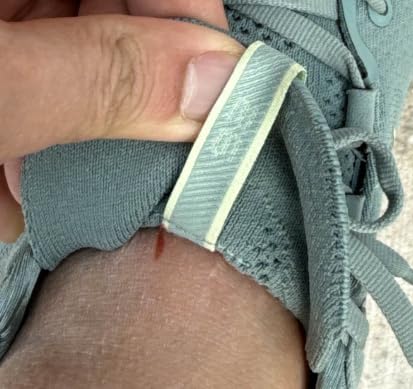 ASICS Gel-Nimbus 26 engineered knit upper close-up showing soft mesh construction and lacing system