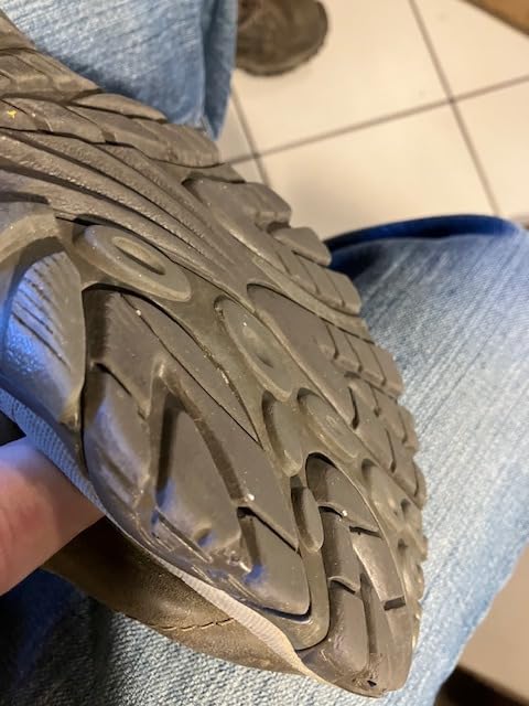 Close-up of Merrell Moab Adventure Lace showing nubuck leather construction and traditional lacing system