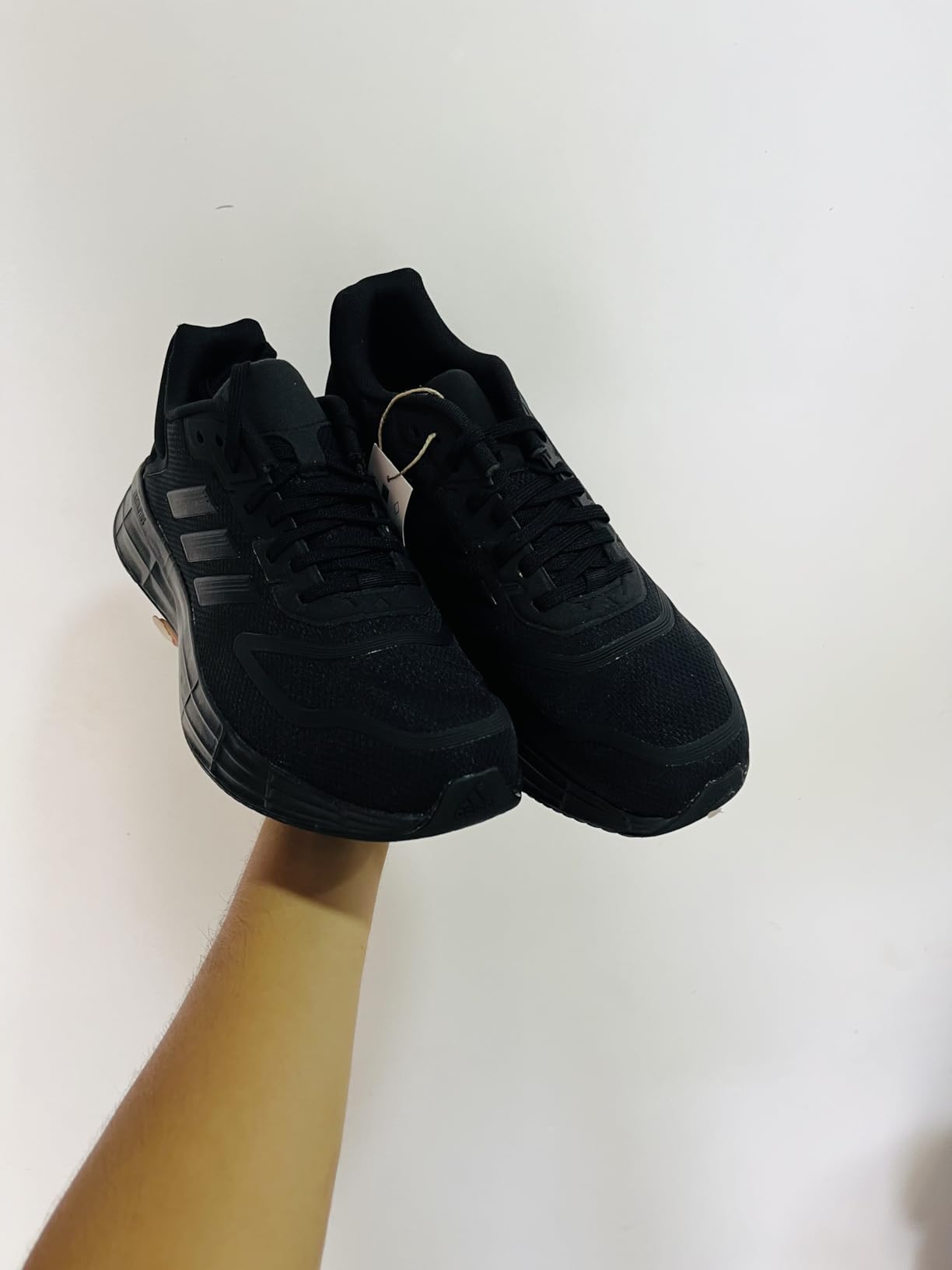 Adidas Duramo SL 2 side profile showing engineered mesh upper panels and three stripes branding