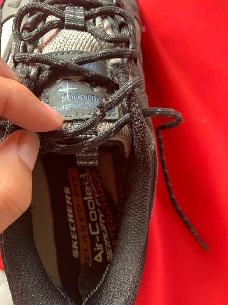 Skechers Selmen-Enago waterproof testing showing water beading off the leather surface during wet trail conditions