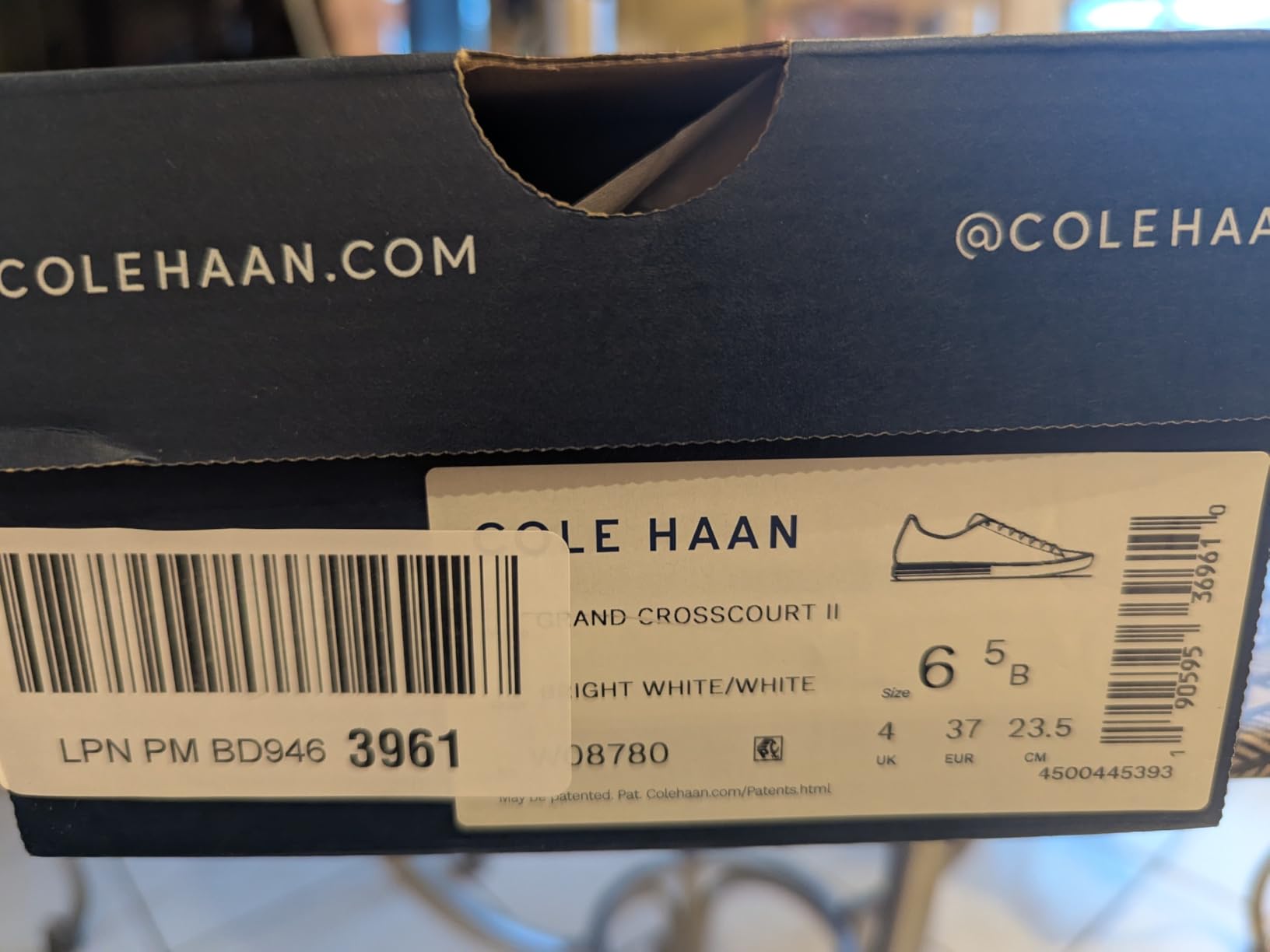 Close-up detail of Cole Haan Grand Crosscourt upper construction and seven-eyelet lacing system