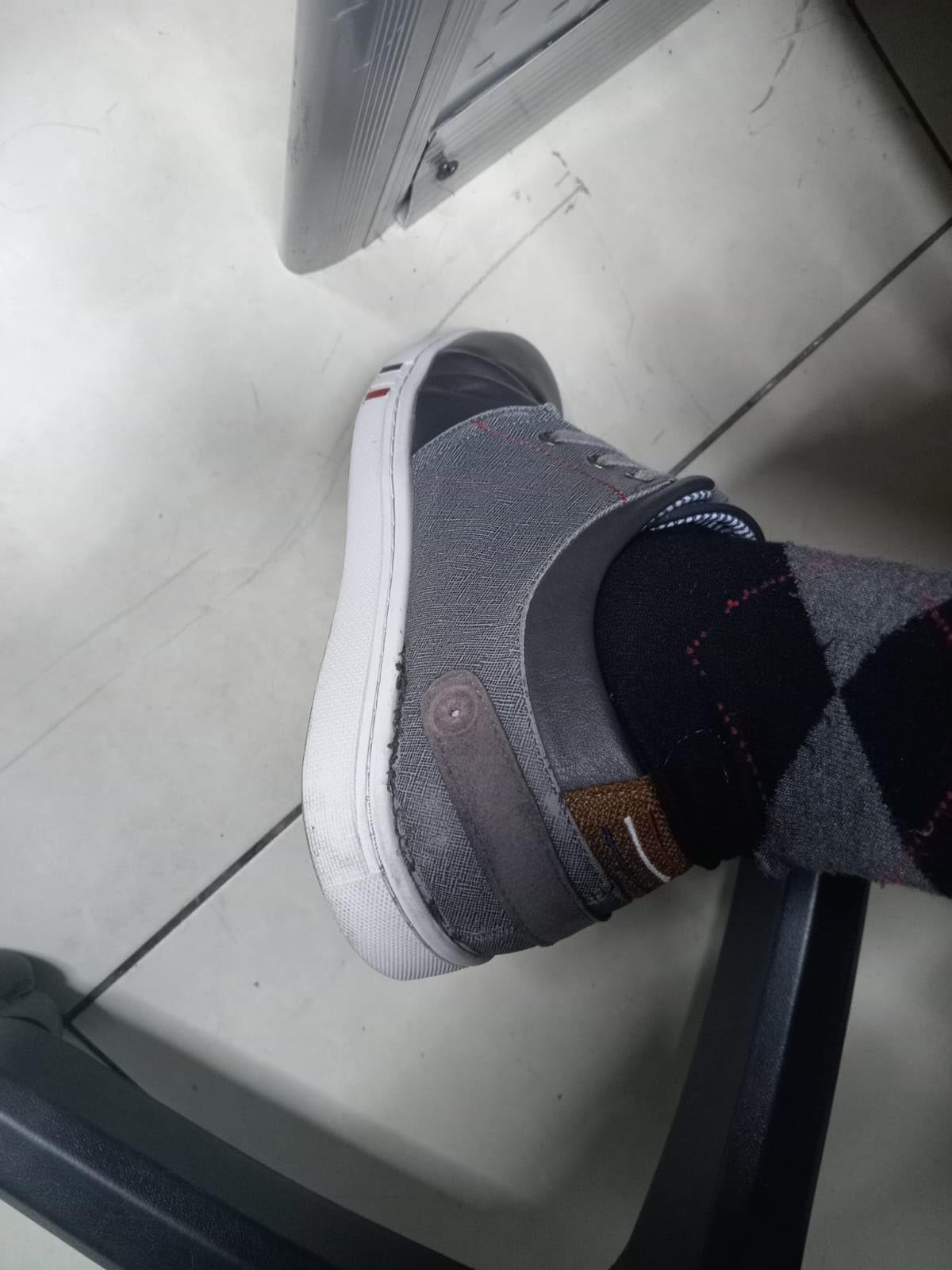 Example of common durability issue showing sole separation on Bruno Marc sneaker at adhesive junction