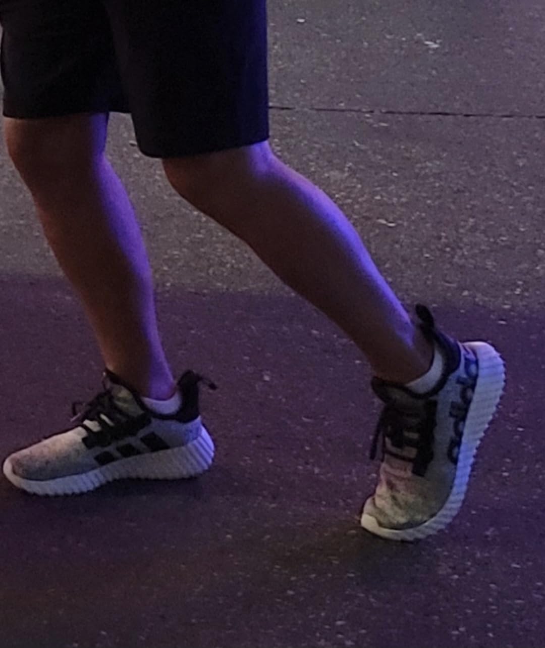 Adidas Kaptir 3.0 side profile showing linear three-stripe branding and heel badge detail
