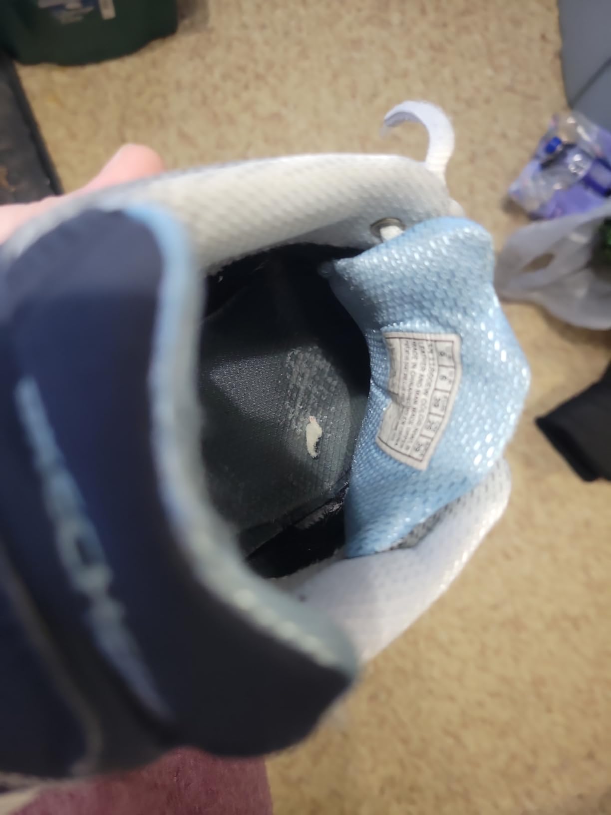 Close-up of the inside heel of a Skechers D'Lite shoe showing wear and lining deterioration after several months of use.