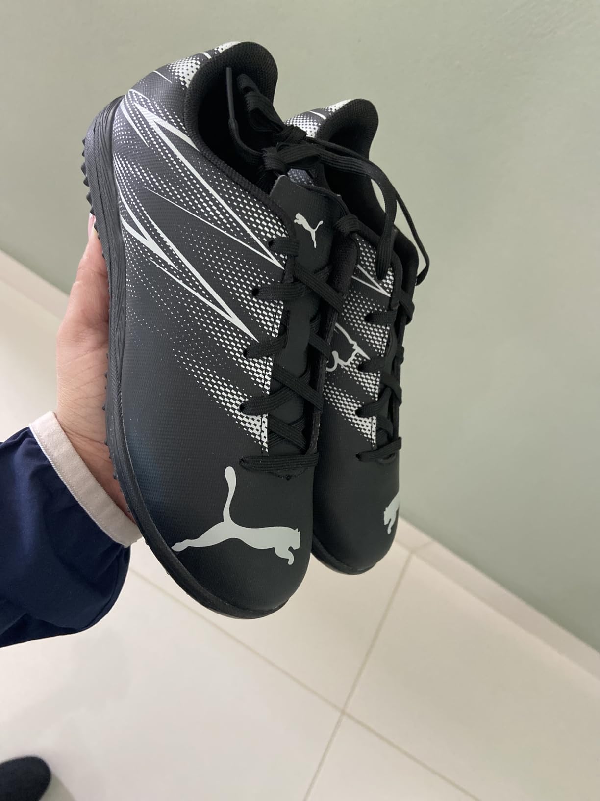 PUMA Attacanto Turf Soccer Cleats showing dynamic graphic design and lace-up closure