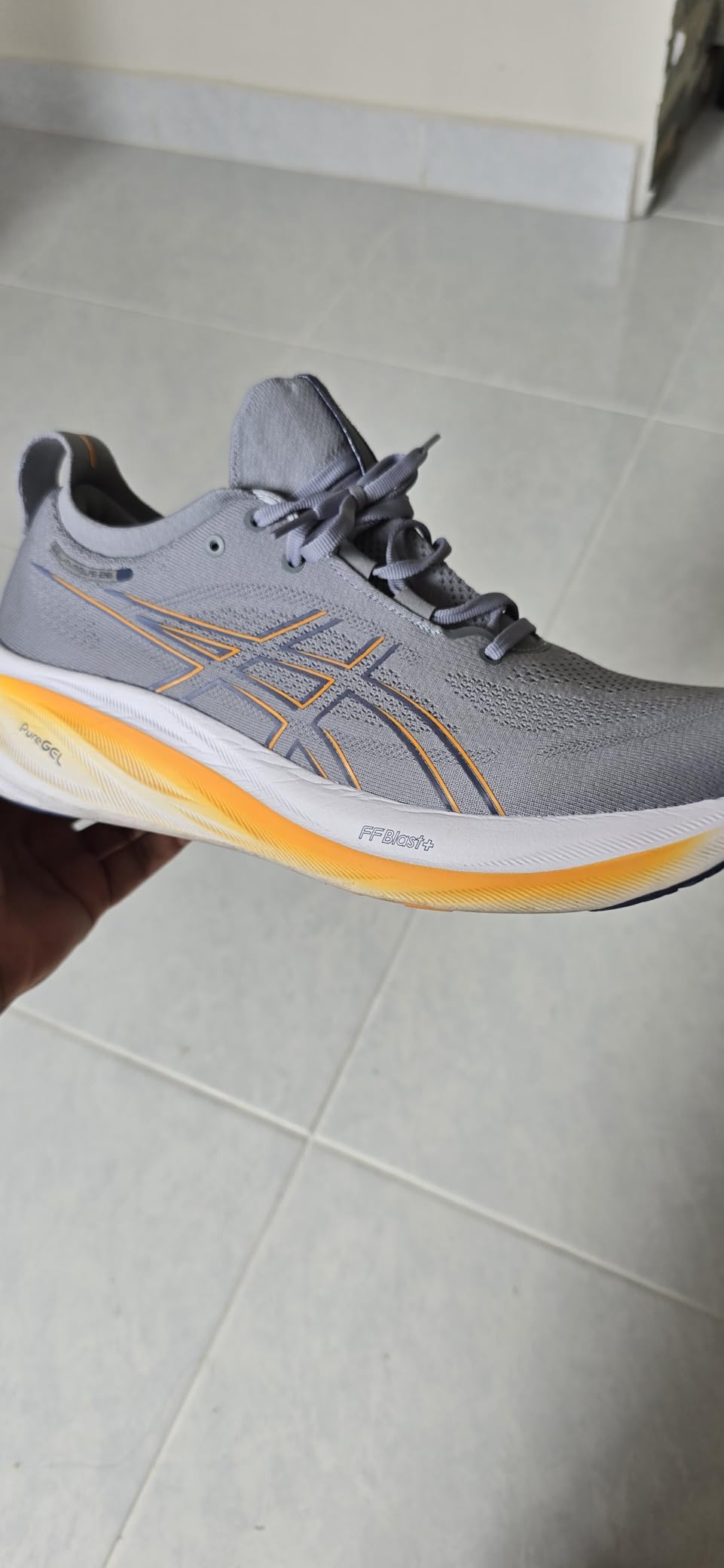 ASICS Gel-Nimbus 26 in use during road running showing cushioning performance at various paces