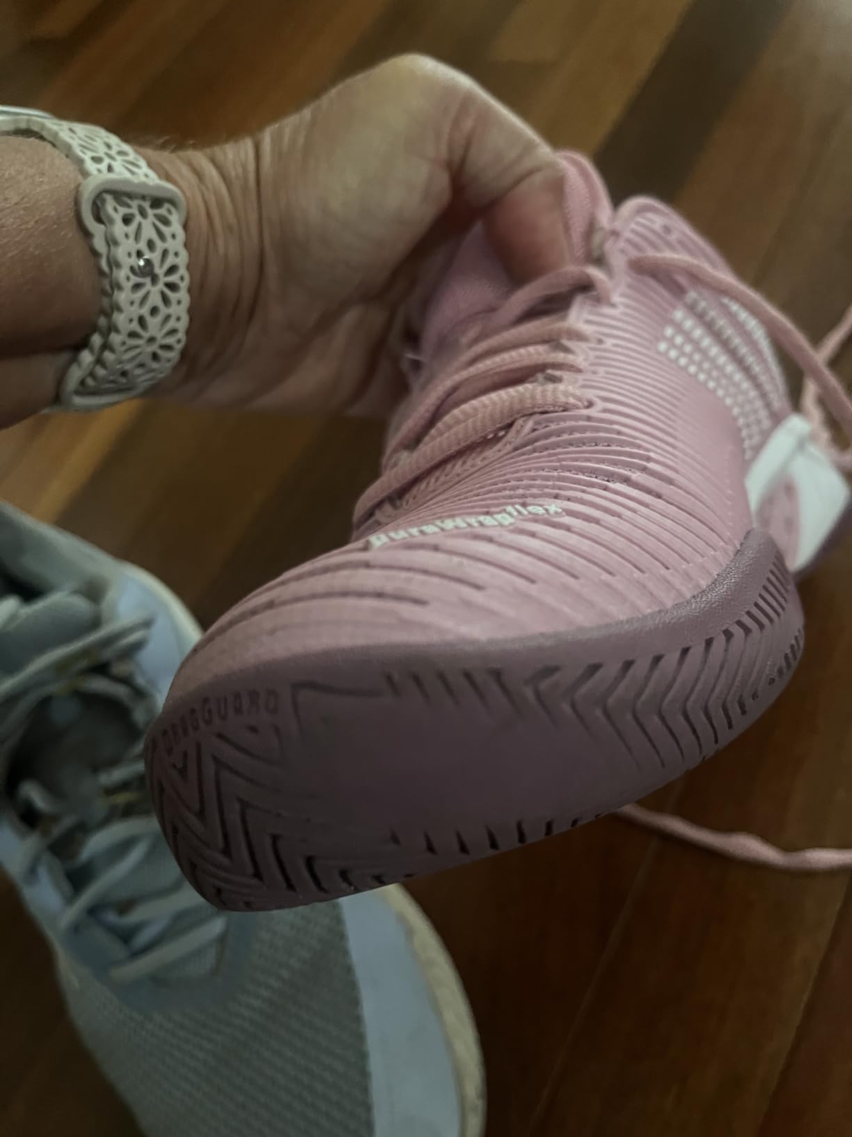 K-Swiss Hypercourt Express 2 outsole compared to another court shoe showing traction pattern depth differences