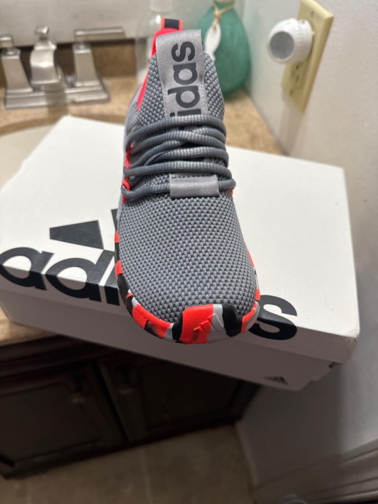 Close-up of Adidas Lite Racer Adapt 7.0 Cloudfoam midsole and rubber outsole construction