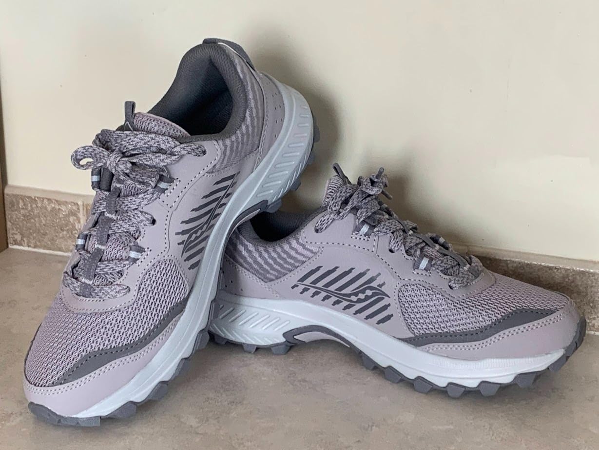 Saucony Excursion TR15 in action on natural trail terrain showing real-world performance during hiking