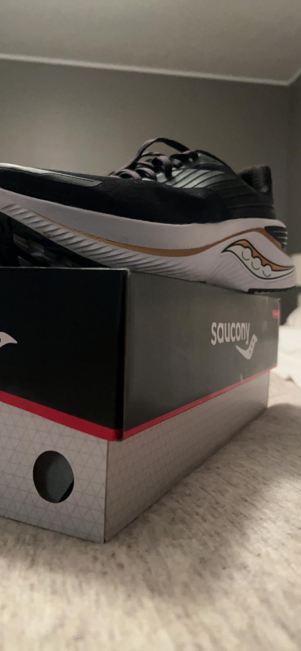 Saucony Endorphin Shift 3 side comparison showing substantial midsole height and heel geometry