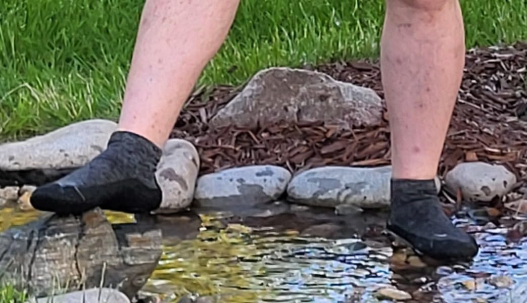 Final lifestyle shot of WHITIN barefoot sock shoes in real-world daily use setting