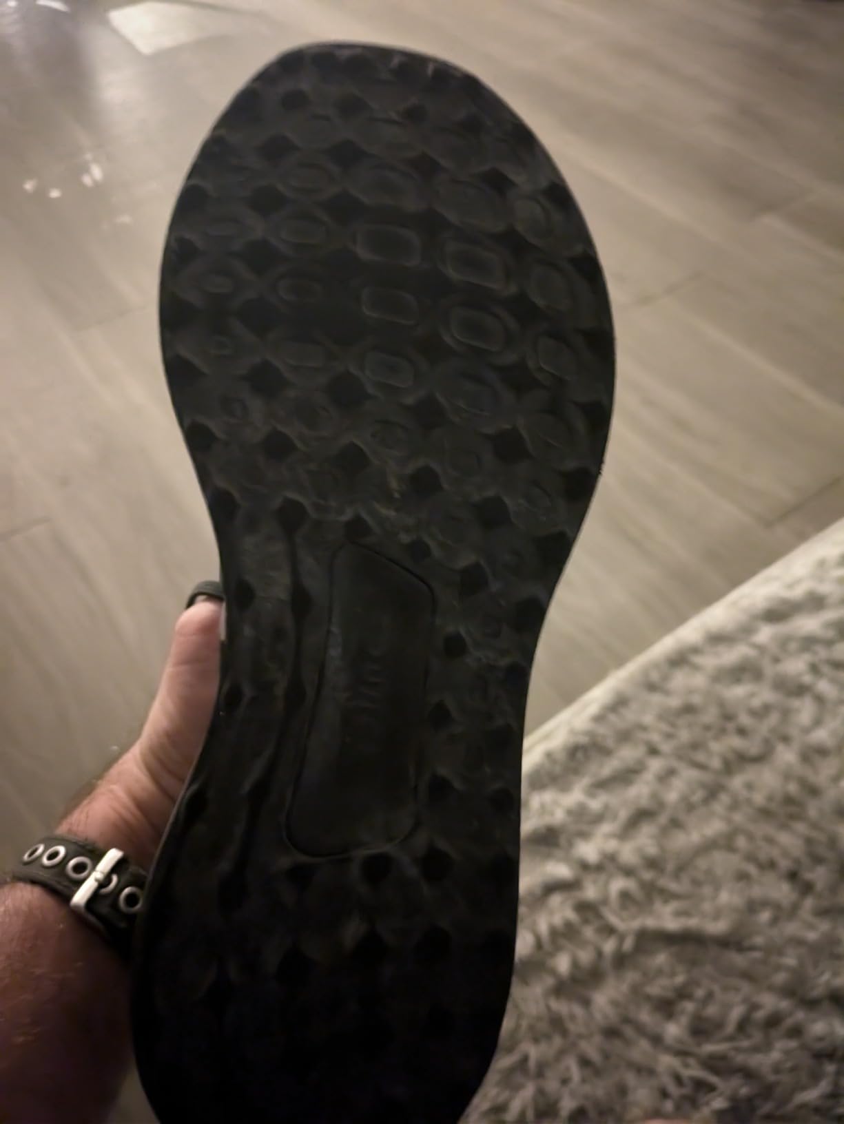 Sole wear pattern on Adidas Ubounce DNA after months of regular use showing outsole deterioration in heel and forefoot areas