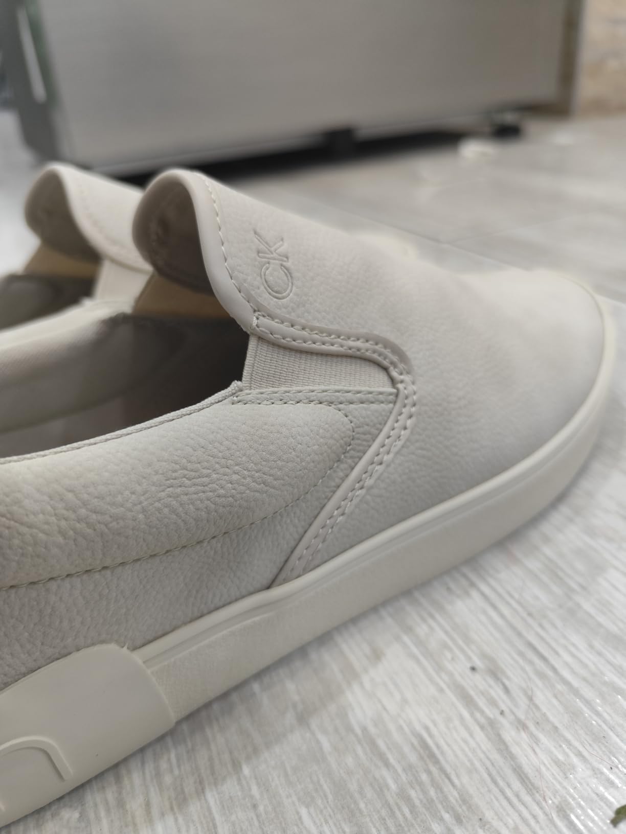 Calvin Klein Ryor heel detail showing CK logo and construction