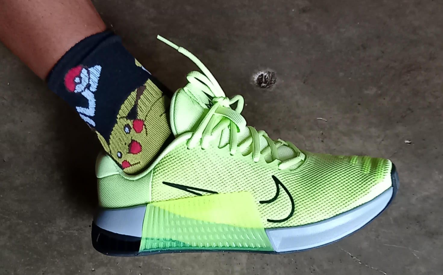 Nike Metcon 9 outsole on gym floor showing herringbone traction pattern