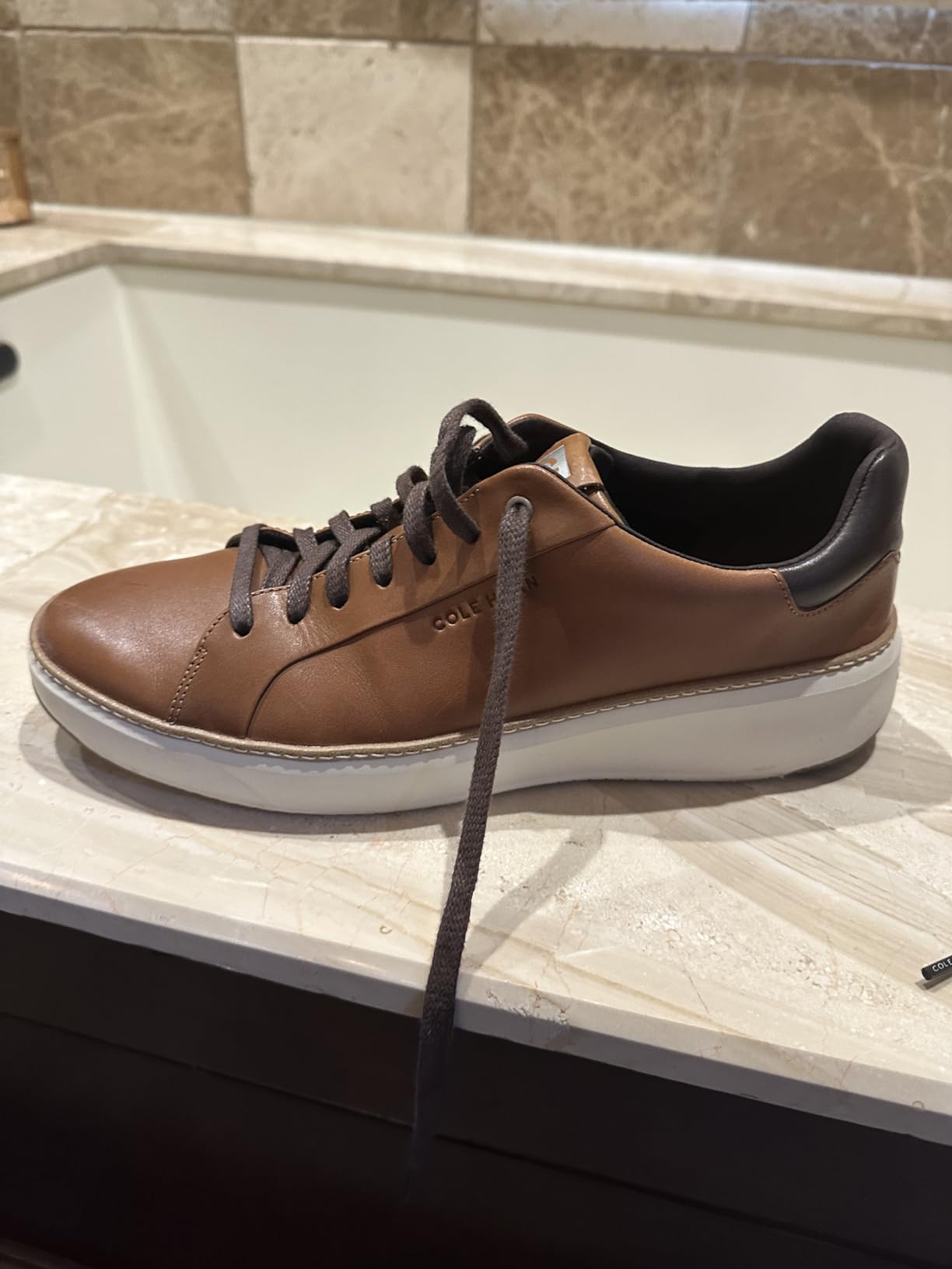 Multiple colorways of Cole Haan Grandpro Topspin showing style versatility across different leather finishes