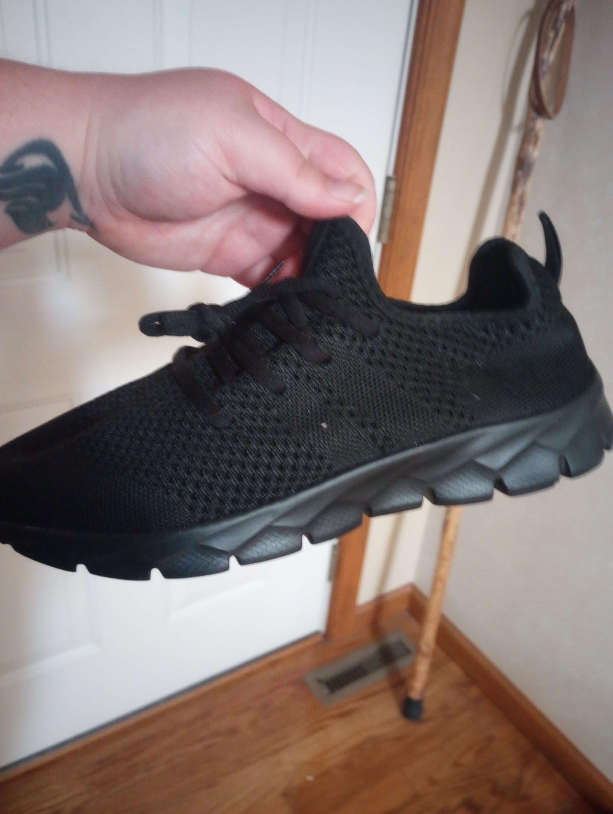 YITUHIO shoe being flexed to show sole flexibility and stress points
