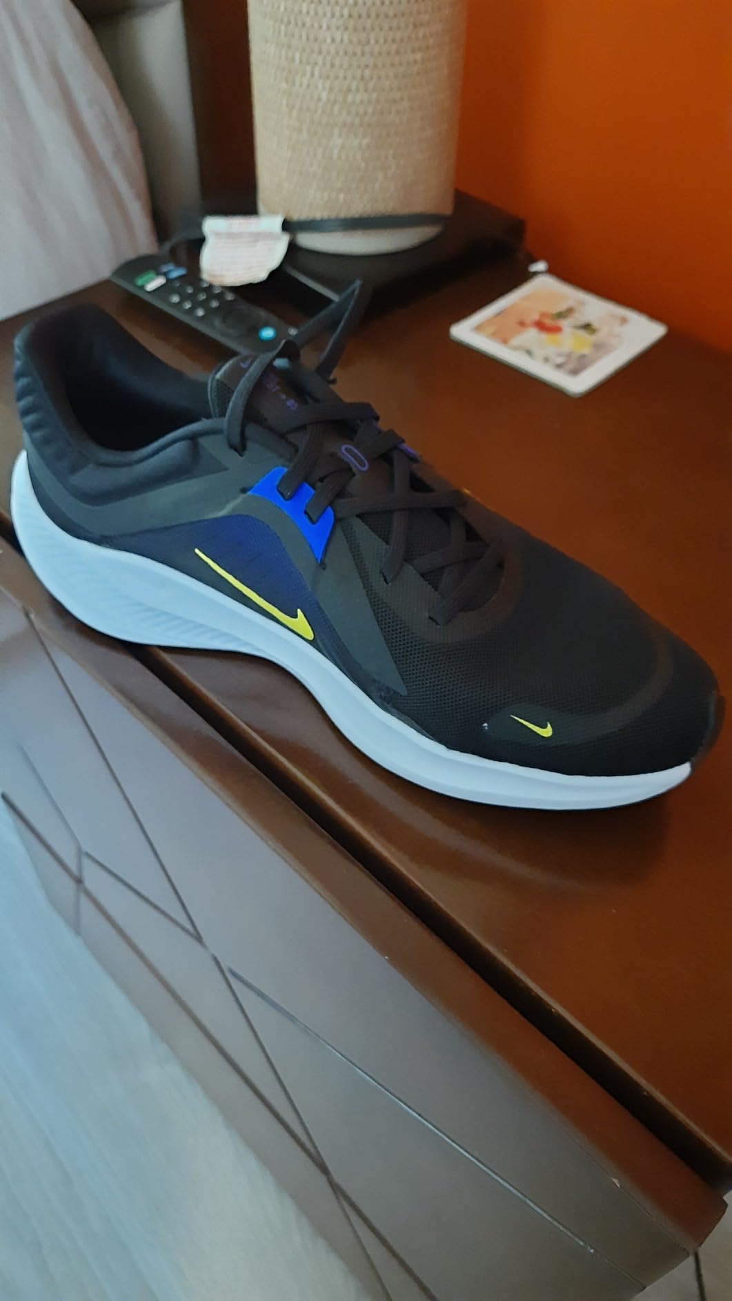 Nike Men's Quest 5 detail showing mesh upper construction and midfoot fitband cable integration