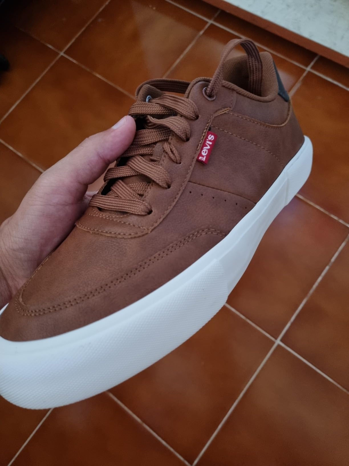 Levi's Munro Newmericana sneaker worn with grey chinos for business casual styling