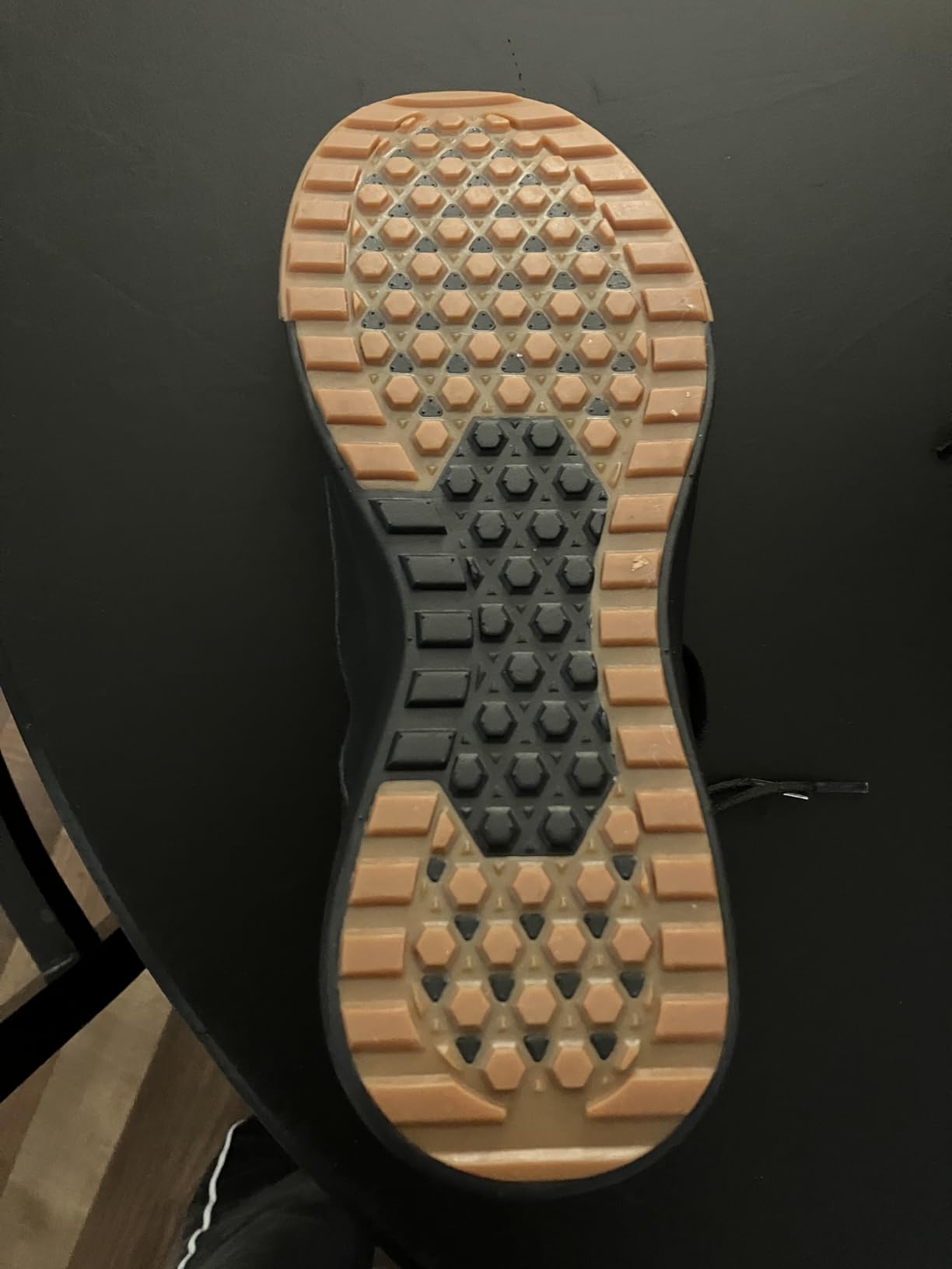 Vans Range EXP being tested on outdoor terrain showing tread pattern grip on varied surfaces