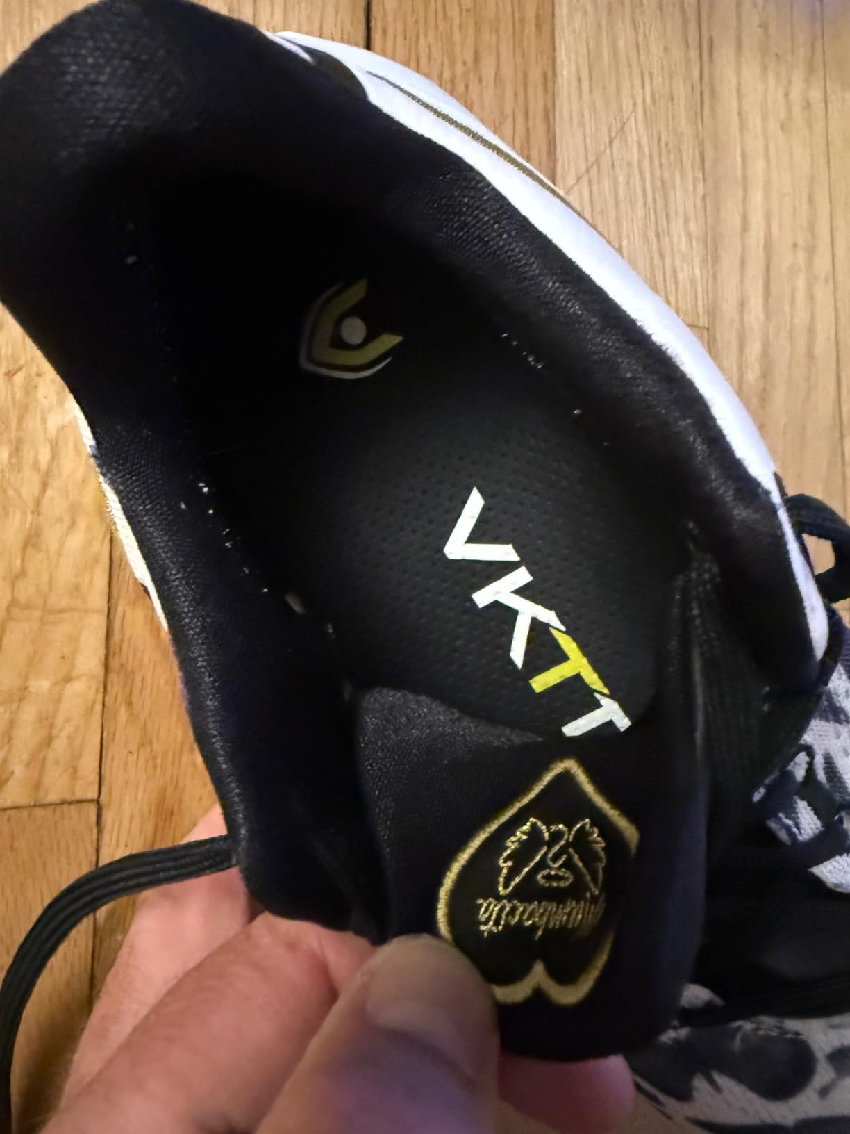 VKTRY Gold carbon fiber insoles showing distinctive black carbon base and gold branding
