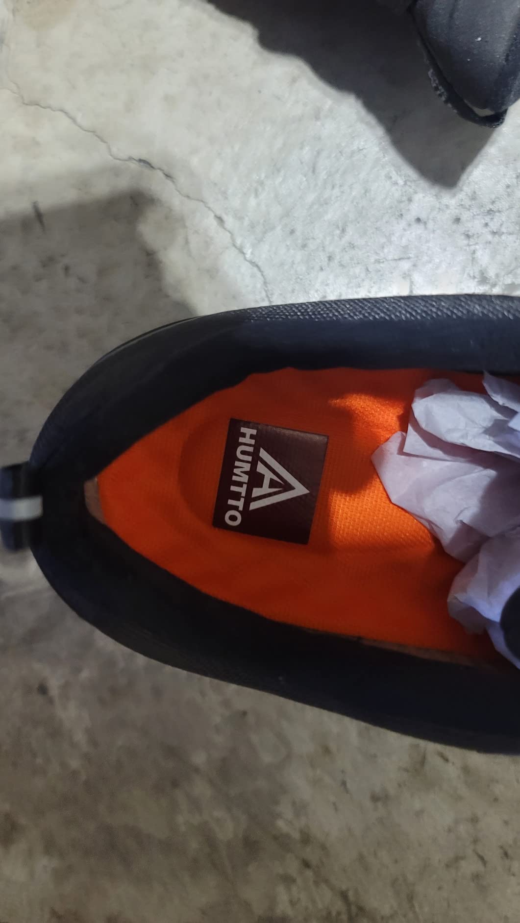 Close-up of HUMTTO hiking shoes showing TPU reinforcement details and fabric upper construction