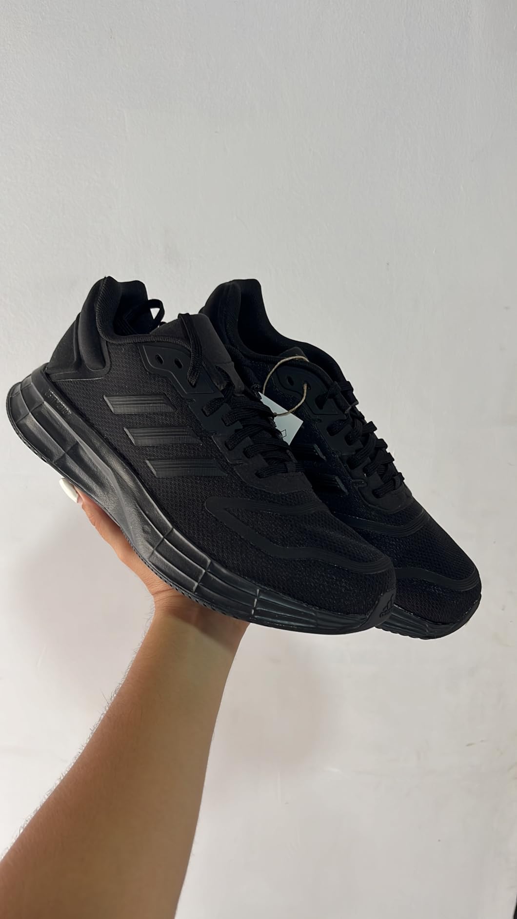 Adidas Duramo SL 2 LIGHTMOTION midsole closeup showing EVA foam structure and outsole transition