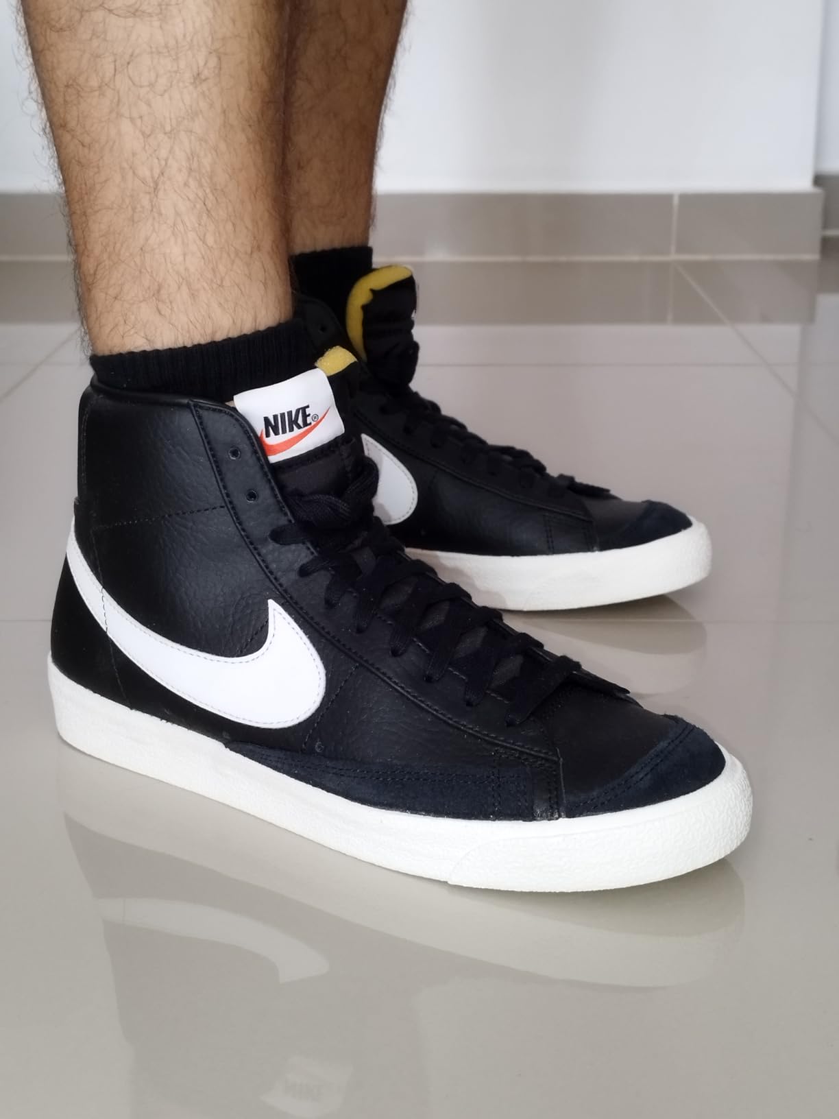 Nike Blazer Mid 77 Jumbo ankle collar and heel construction showing elastic corduroy texture and pull tab