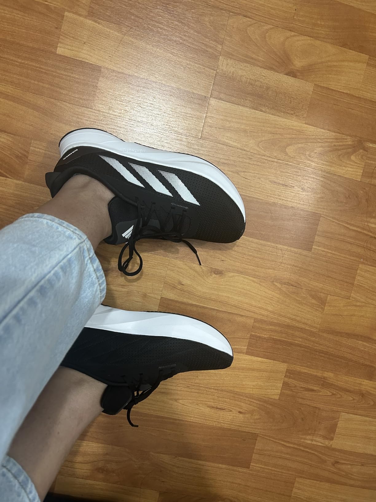 Adidas Duramo SL lifestyle shot showing casual and athletic versatility